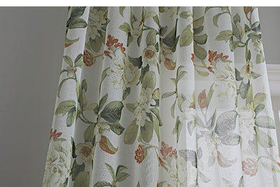 Dark gray semi-sheer curtains with a white and green floral pattern, hung on a black rod in a living room. - Image 18
