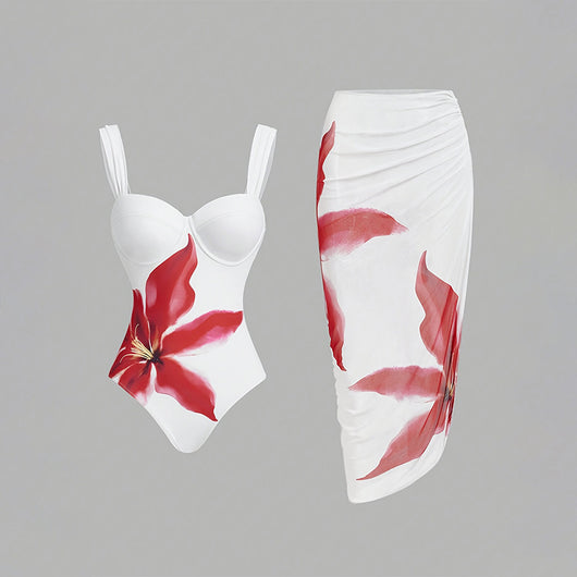 White one-piece swimsuit with red floral print and matching ruched sarong skirt for beach or resort wear. - Image 6