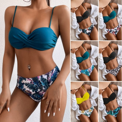 Teal twisted bandeau bikini top with tropical leaf print high-waisted bottoms on a model wearing a white shirt. - Image 14