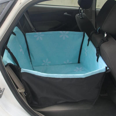 Brown pet car mat with colorful dog pattern installed in a car's rear seat, protecting upholstery. - Image 3