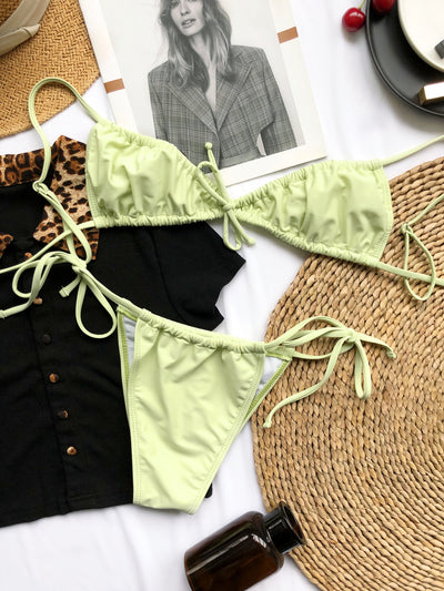 Light blue pleated bikini with triangle top and thong bottom, featuring adjustable tie closures on both pieces. - Image 18