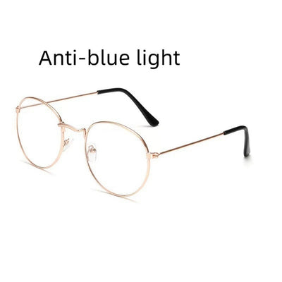 Retro oval anti-blue light glasses with a dark metal frame and clear lenses on a white background. - Image 8