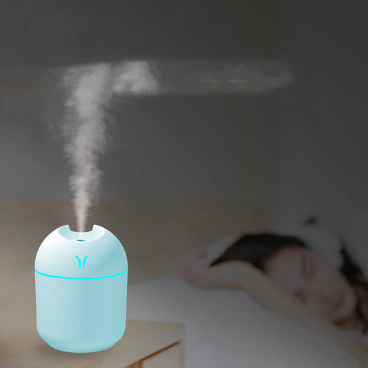 Light blue mini desktop humidifier with an orange accent line and a small orange logo, featuring a single mist outlet. - Image 2