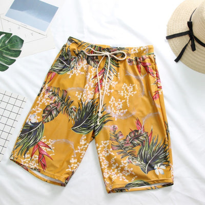 Pink tropical print three-piece women's swimwear set with ruffled bikini top, high-waisted bottoms, and matching sarong. - Image 7