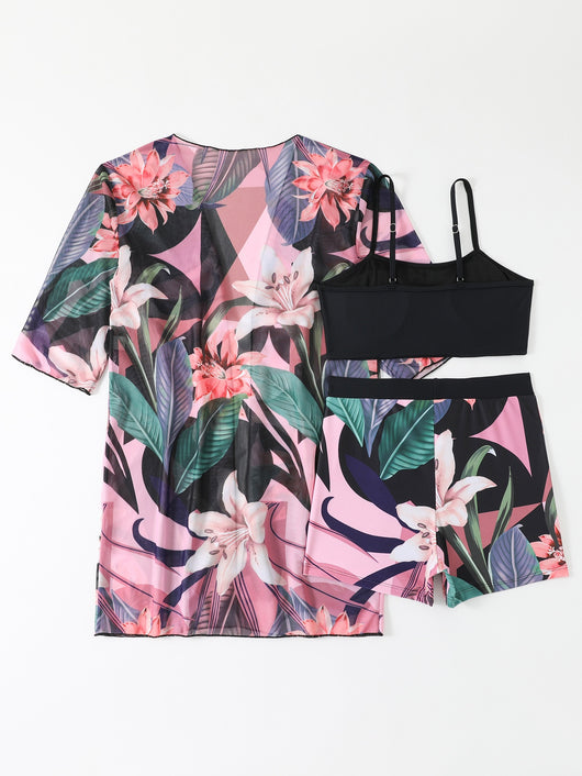 Woman in a three-piece bikini swimsuit set with a black tube top, floral boy shorts, and a sheer floral kimono cover-up. - Image 9