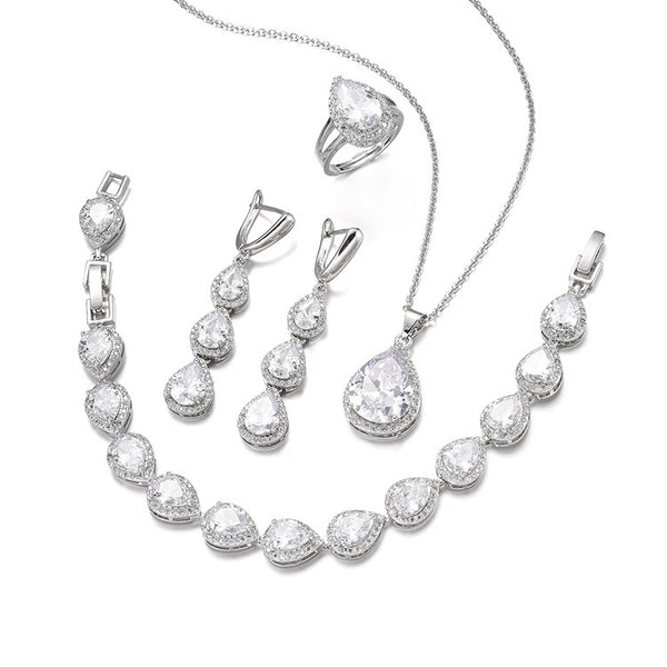Green pear-shaped gemstone jewelry set with necklace, dangle earrings, ring, and bracelet, all with clear stone accents. - Image 6
