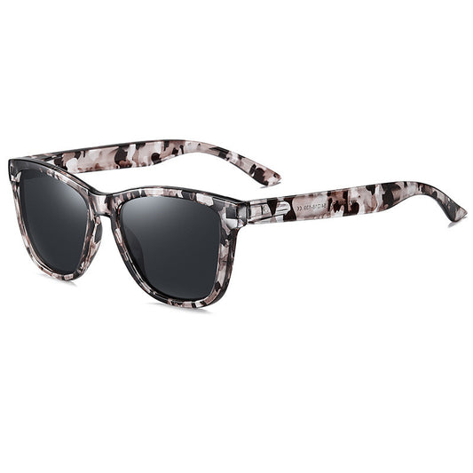 Universal polarized retro square sunglasses with a multi-color camouflage pattern frame and dark lenses.