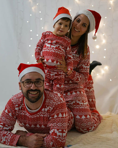 Red and white Christmas pajama set with long-sleeve top and pants, featuring a Fair Isle reindeer and tree print.