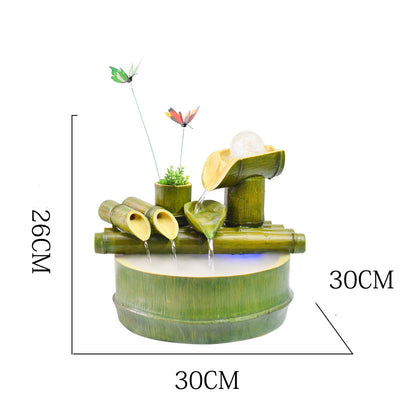 Green bamboo-themed indoor water fountain with multiple tiers, a water wheel, and small frog and butterfly accents. - Image 3