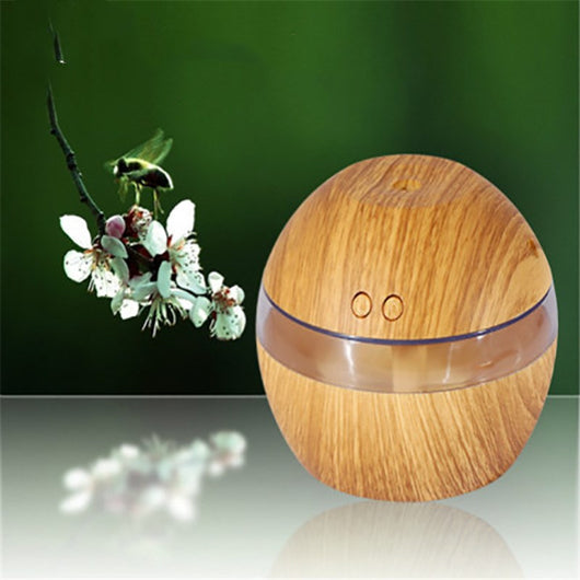 Spherical wood grain humidifier with a clear band, emitting mist, against a dark background with lotus flowers. - Image 7