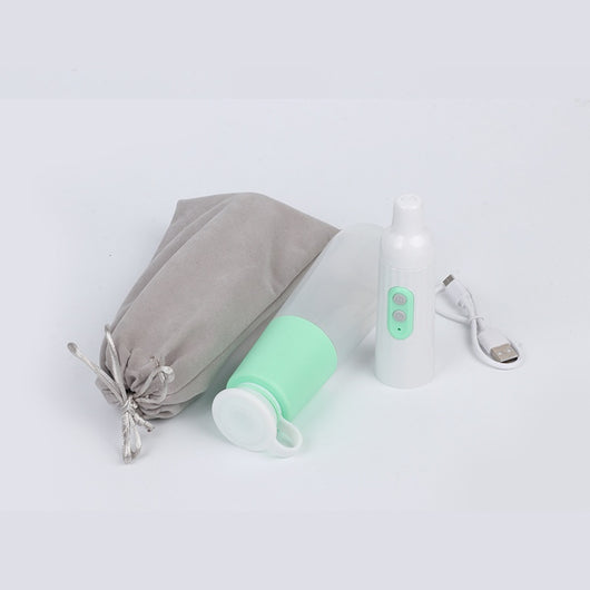 Portable electric bidet with translucent water bottle, white handheld spray unit, USB cable, and grey travel pouch. - Image 7