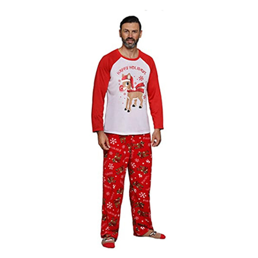 Family of five and a dog wearing matching red and white Christmas pajamas with reindeer and snowflake prints. - Image 4