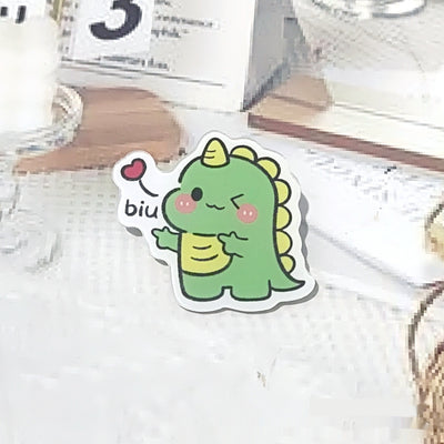 Cute green cartoon dinosaur acrylic badge brooch with a shy expression and small spikes on its back. - Image 27
