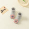 Gris Con Flores Pequeñas Talla XS (0 6 Meses)