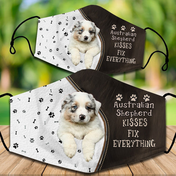 Two cotton face masks with a French Bulldog puppy peeking out, paw prints, and "French Bulldog Kisses Fix Everything" text.