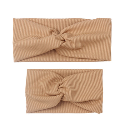 Matching dusty rose ribbed knit headbands with a twisted knot, one for an adult and one for a child. - Image 18
