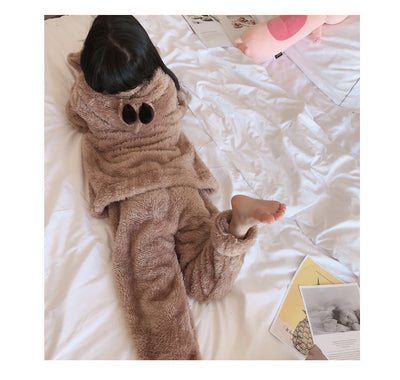 Mother and child wearing matching brown plush bear pajamas with hoods, ears, and embroidered paw gloves. - Image 9