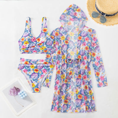 Woman in a red multicolor floral print three-piece swimsuit with high-waisted bikini and long-sleeve cover-up, straw hat, and sunglasses on a beach. - Image 26