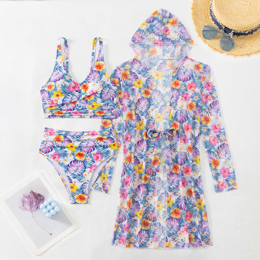 Woman in a red multicolor floral print three-piece swimsuit with high-waisted bikini and long-sleeve cover-up, straw hat, and sunglasses on a beach. - Image 26
