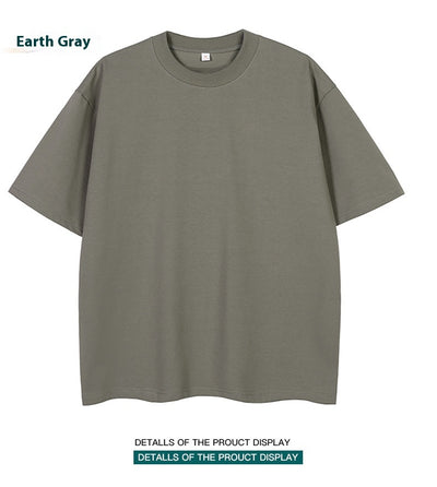 Moss green short-sleeve cotton t-shirt with a crew neck and a relaxed, oversized fit. - Image 14