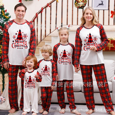 Family of four wearing matching green plaid Christmas pajamas with "Merry Christmas" and Christmas tree print. - Image 8