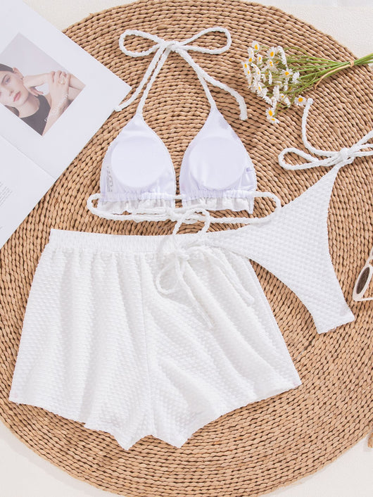 White polka dot three-piece swimsuit for women, featuring a halter bikini top with ruffled trim and matching high-waisted shorts. - Image 7