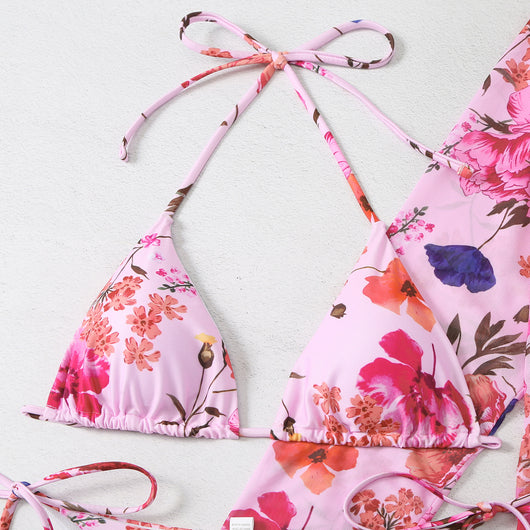 Milky white floral print three-piece swimsuit with triangle bikini top, v-cut bottom, and sheer long-sleeve cover-up. - Image 14