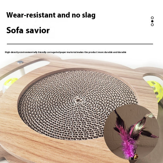 Multi-level cat scratcher with a round corrugated cardboard surface, a wooden track with a green ball, and a pink feather wand with a bell. - Image 2