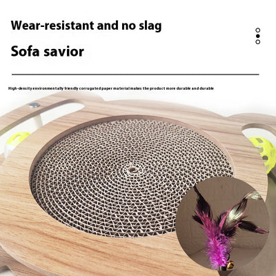 Multi-level cat scratcher with a round corrugated cardboard surface, a wooden track with a green ball, and a pink feather wand with a bell. - Image 2