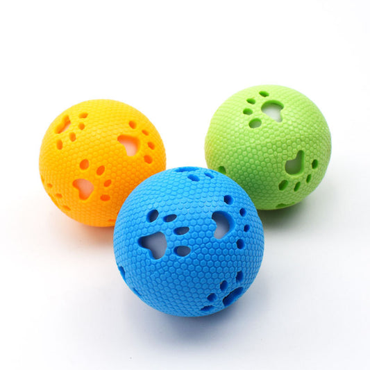 Green TPR hollow pet ball with honeycomb texture and paw print cutouts, designed for play.