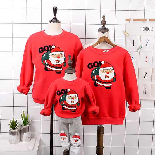 Red parent-child Christmas sweaters with a cartoon Santa Claus graphic, displayed on adult and child mannequins. - Image 11