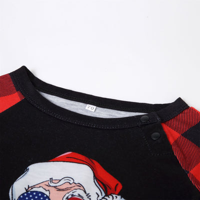 Christmas pajama set with a black long-sleeve top featuring a Santa head in American flag sunglasses and red and black buffalo plaid pants. - Image 10