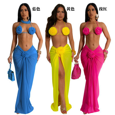 Blue three-piece bikini set with floral appliques on the triangle top, thong bottom, and matching ruched maxi skirt. - Image 24