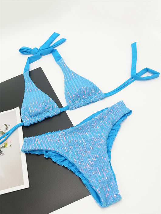 Pink and yellow sequined halter bikini top and high-cut bottoms on a model against a clear blue sky. - Image 27