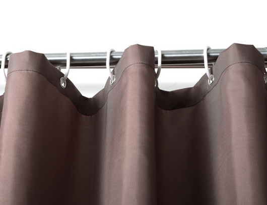 Solid brown polyester shower curtain with metal grommets and hooks, hanging from a silver shower rod. - Image 4