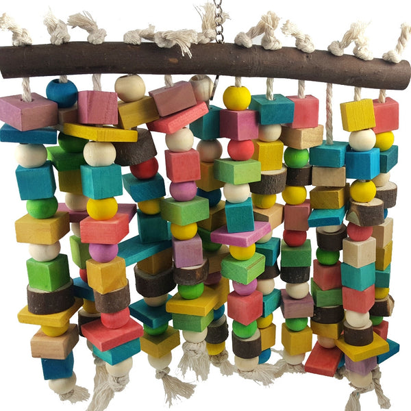 Colorful wooden parrot bite toy with a natural branch hanger and multiple strings of beads and blocks.