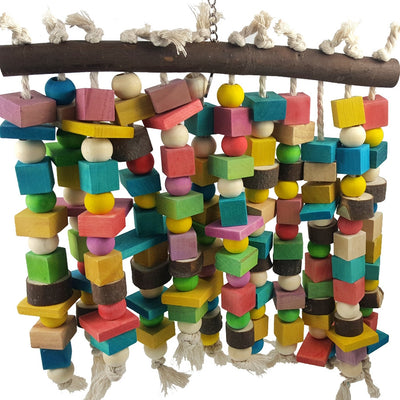 Colorful wooden parrot bite toy with a natural branch hanger and multiple strings of beads and blocks.