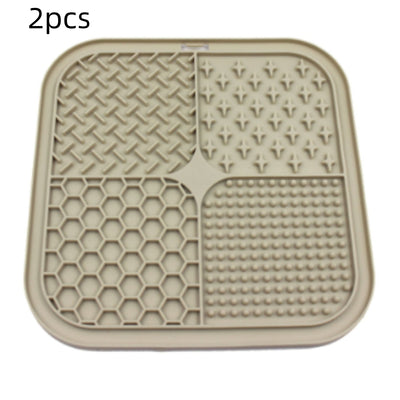 Gray silicone pet licking pad with four textured sections, designed for slow feeding and anti-choking. - Image 11
