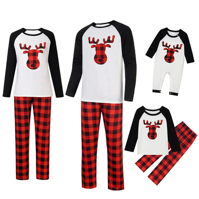 White long-sleeve pajama top with "wild one" graphic and red and black plaid pants. - Image 26