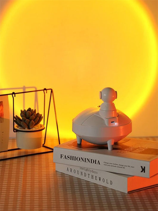 White astronaut sunset lamp humidifier with a 360-degree rotating head and two spray modes, on a light background. - Image 16