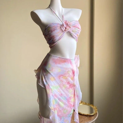 Women's floral split skirt-style swimsuit bikini three-piece suit with halter top and sheer wrap skirt. - Image 11