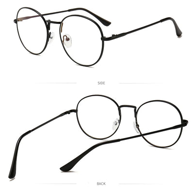 Black round anti-blue light glasses with clear lenses showing a blue reflection, resting on a gray textured surface. - Image 10