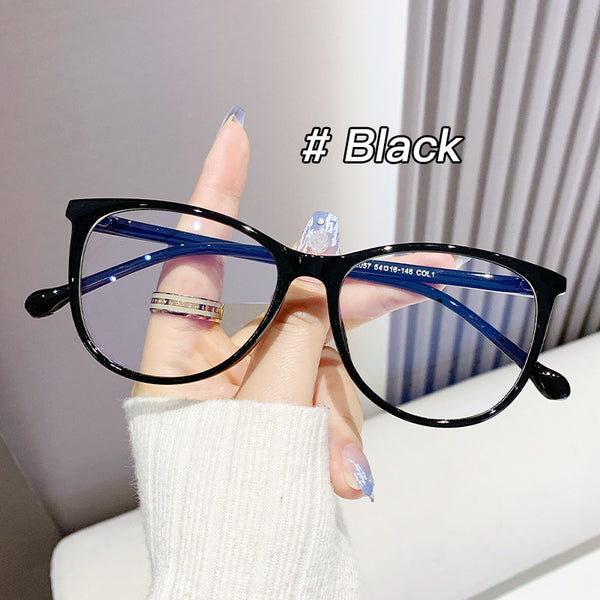 Black full-frame round anti-blue light glasses held by a hand with a gold ring and light blue gradient nails. - Image 6