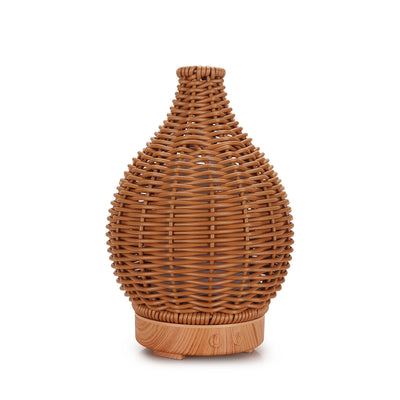 Mini ultrasonic aroma diffuser with a brown hollow rattan-style body and a white base, featuring control buttons. - Image 2