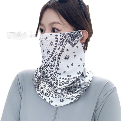 Black paisley sun mask with white pattern and ear loops, covering the lower face and neck, worn outdoors. - Image 11