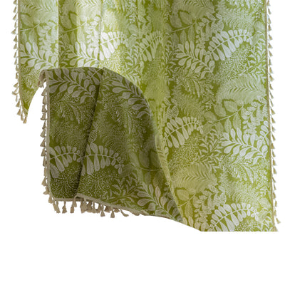 Green curtain with white leafy botanical pattern and cream tassels, hanging in a window with natural light. - Image 5