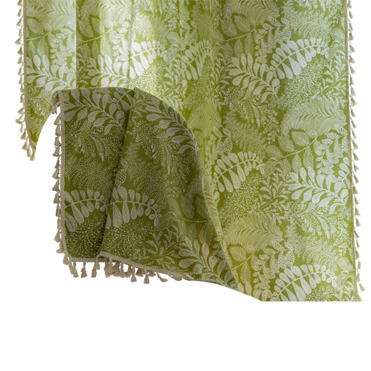 Green curtain with white leafy botanical pattern and cream tassels, hanging in a window with natural light. - Image 5