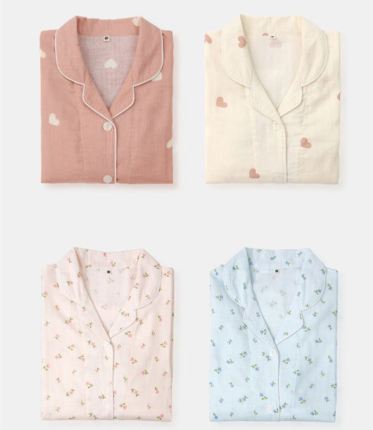 Pink long-sleeved pajama set for children with an all-over cherry print, Peter Pan collar, and matching pants. - Image 3