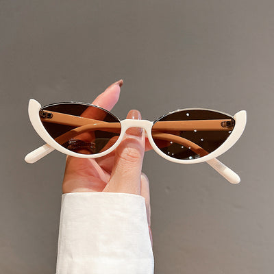 Pink cat-eye sunglasses with purple gradient lenses on a white background, showcasing a trendy style. - Image 7