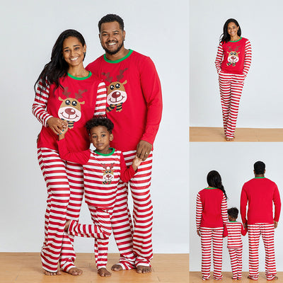 Young boy wearing a red and white striped long-sleeved pajama set with a reindeer graphic on the chest. - Image 4
